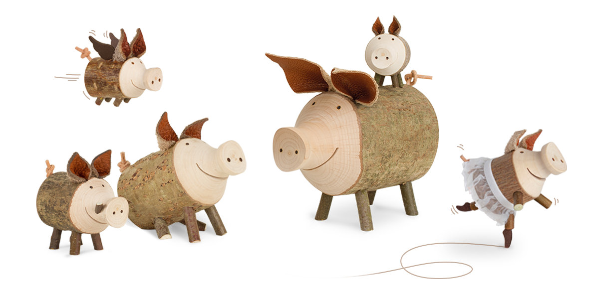 Waldfabrik Schweinerei - viele Holz-Schweinchen auf einem Haufen
